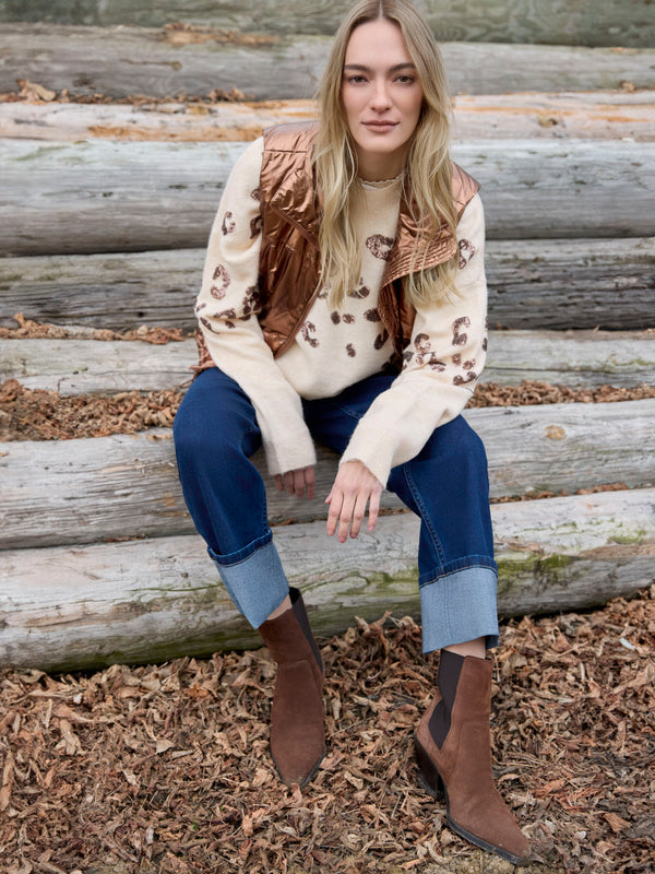 Fashion-forward copper vest perfect for layering over printed sweaters by Charlie B.