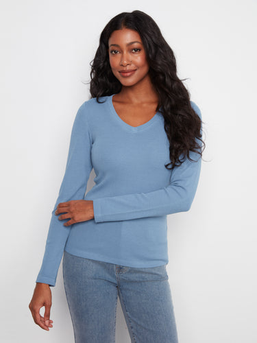 Blue top featuring a flattering V neckline, crafted from a stretch cotton-tencel blend for added comfort and style by Charlie B.