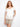 This white crochet top features a scoop neckline, adding elegance to any outfit. Made from 100% cotton for comfort and style by Charlie B.