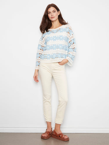 Experience the charm of 3/4 bell sleeves in this lovely crochet top. The intricate design highlights its unique appeal by Charlie B.