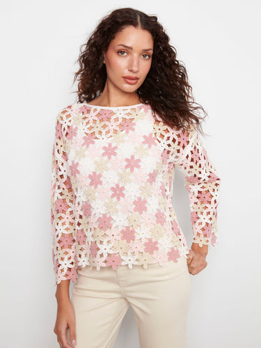 Crochet top in white with pink floral accents, featuring a boat neckline and 3/4 sleeves. Perfectly crafted by Charlie B.