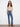 Medium blue jeans with a bootcut fit and floral embroidery, crafted from stretch denim for comfort by Charlie B.