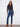 Indigo jeans with floral embroidery and a bootcut fit, offering a stylish long length by Charlie B.