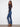 Floral embroidered bootcut jeans in indigo, designed with a five-pocket style for practicality by Charlie B.