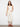 Natural cropped twill pants featuring a regular rise and intricate hem embroidery by Charlie B.