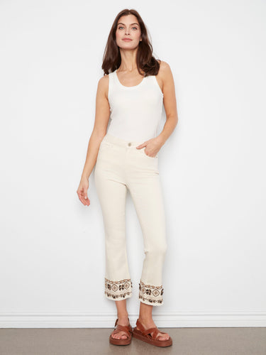 Natural cropped twill pants featuring a regular rise and intricate hem embroidery by Charlie B.