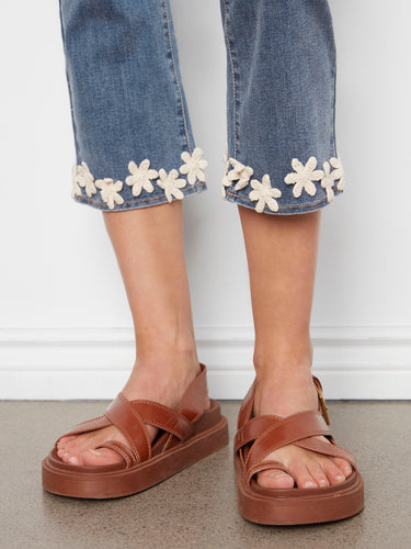 Medium blue jeans in cropped length with regular rise, adorned with charming floral embroidery at the hem by Charlie B.