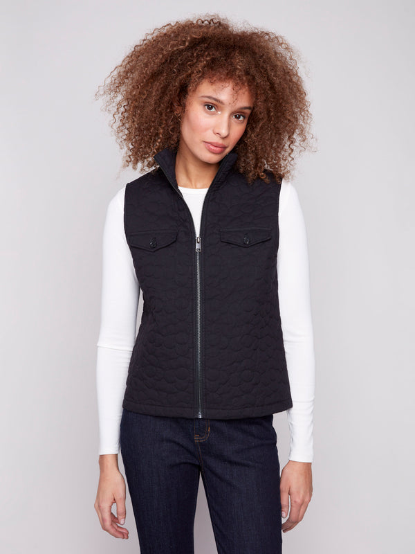 Elegant black vest with a floral quilted design and convenient welt pockets, perfect for layering by Charlie B.