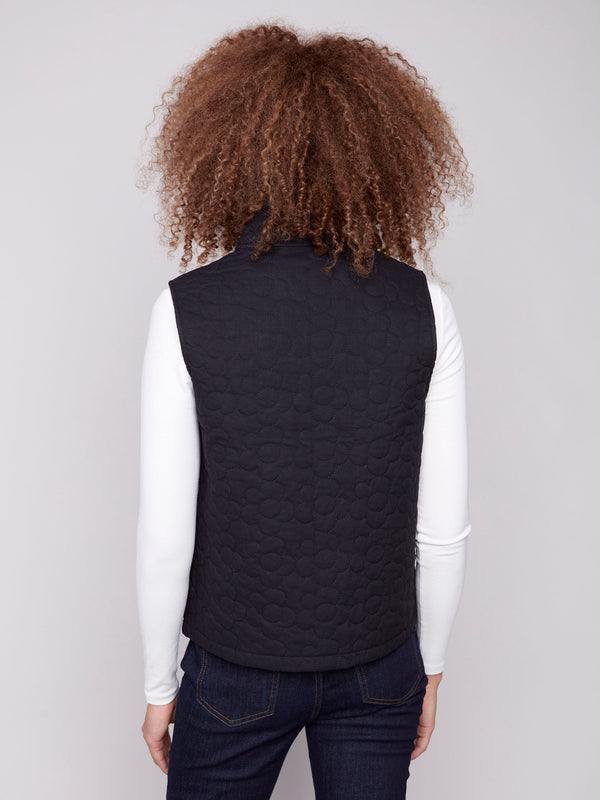 Chic black vest showcasing a unique quilted floral pattern, ideal for casual or formal wear by Charlie B.