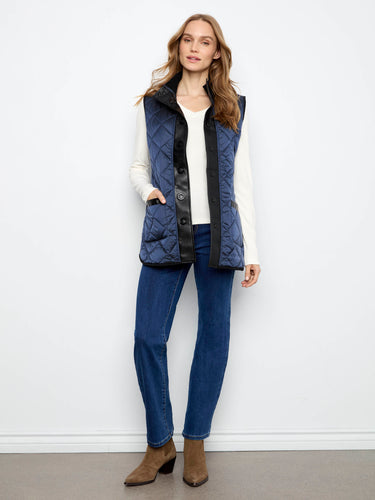 Quilted vest with snap-button closure and sleek design, perfect for stylish layering. By Charlie B.