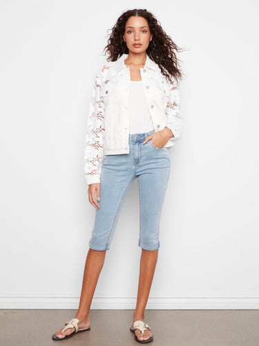 This elegant white twill jacket offers button closure with exquisite floral embroidery on the sleeves by Charlie B.