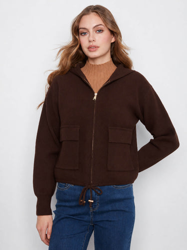 Stylish brown jacket designed with a hood and drawstrings, combining practicality with modern fashion flair. By Charlie B.