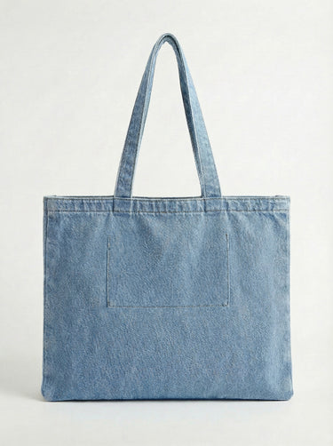 Crafted from durable denim, this tote includes a practical interior pocket for organization by Charlie B.