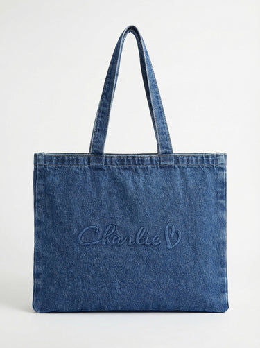 Stylish denim bag with carry handles and embossed Charlie B logo, perfect for daily use. By Charlie B.