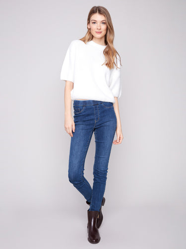 Soft ecru sweater with a relaxed fit, perfect for cozy days while maintaining style and comfort by Charlie B.