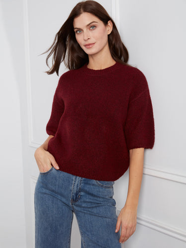 The balloon elbow sleeves on this sweater add a playful touch to its classic style. By Charlie B.