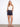 Stretch denim shorts featuring a relaxed fit and stylish belted design, perfect for casual wear. By Charlie B.