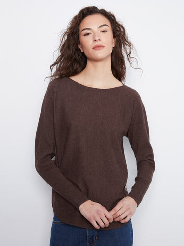 Brown sweater with elegant boat neck design, perfect for a sophisticated look. Crafted with care by Charlie B.