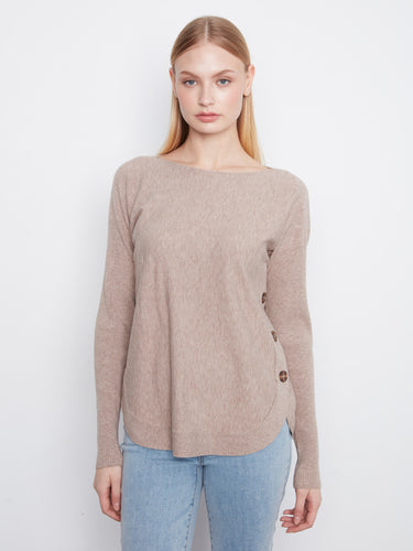 Sweater with a stylish boat neck, offering a chic and modern look. Perfect for any casual outing. By Charlie B.