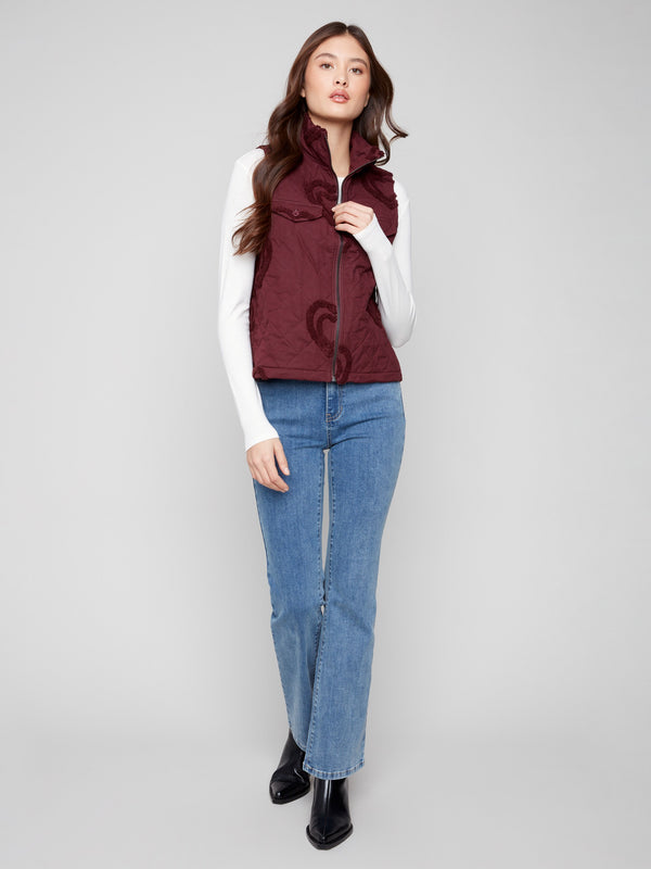 Elegant cabernet vest with a chic zip front closure and boucle heart accents for added charm by Charlie B.