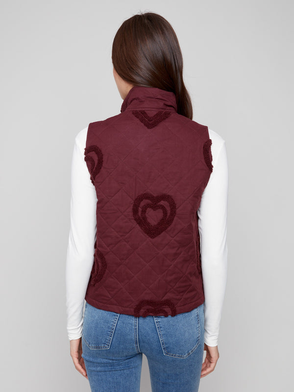 Quilted cabernet vest showcasing intricate boucle heart designs, ideal for a cozy yet fashionable outfit by Charlie B.