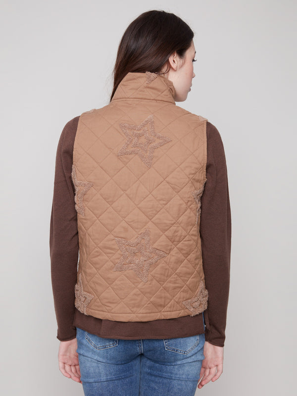 Elegant khaki quilted vest with practical welt pockets, offering both style and functionality by Charlie B.