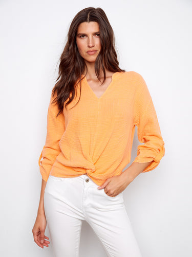 Orange top with a stylish notch neckline and front knot detail, crafted from 100% cotton for comfort and breathability by Charlie B.