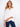 White blouse in 100% cotton featuring a stylish front knot and chic roll-up sleeves by Charlie B.
