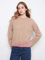 This sweater features a classic crew neckline, offering timeless style and comfort. By Charlie B.
