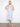 Light blue floral pattern dress with midi length, perfect for versatile styling. Features a unique removable strap by Charlie B.