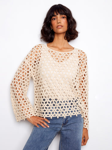 Elegant crochet top with a stylish boat neckline, perfect for any occasion. Crafted to enhance your wardrobe effortlessly by Charlie B.