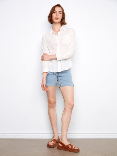 This white button-up shirt features a refined tailored collar, perfect for both casual and formal settings by Charlie B.