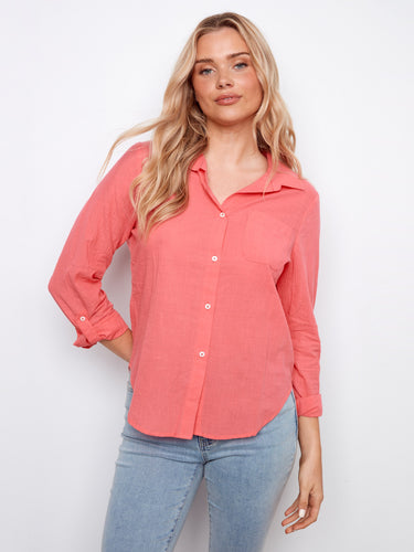 Coral shirt with a classic collar, featuring a stylish chest pocket and button-front closure. Crafted from 100% cotton by Charlie B.