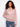 Pink crochet sweater with a hooded design, featuring intricate patterns and soft texture for a cozy feel by Charlie B.