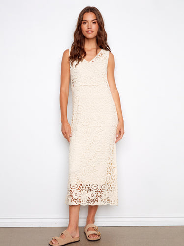 This dress features a V-neckline and showcases a classic, elegant style perfect for any occasion. By Charlie B.