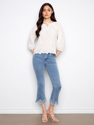 Cotton blouse showcasing intricate eyelet detailing, complemented by 3/4 sleeves and a scalloped hem by Charlie B.