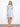 The dress features a classic shirt collar, adding a touch of sophistication to the overall look. Designed by Charlie B.