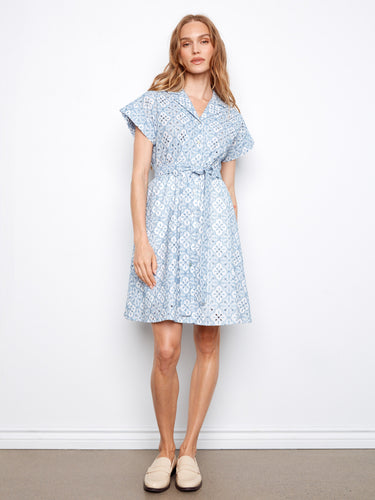 The dress features a classic shirt collar, adding a touch of sophistication to the overall look. Designed by Charlie B.