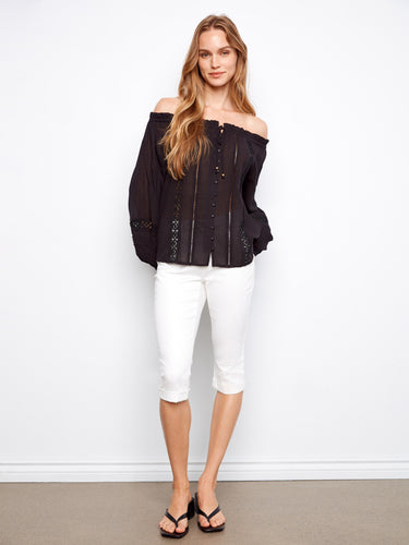 Elegant black blouse with button-front details and openwork trim for a chic look by Charlie B.