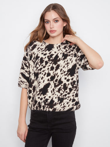Chic top with a mock neck, featuring a stylish animal print pattern and soft brushed knit fabric for ultimate comfort by Charlie B.