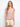 The top features a stylish boat neckline with pink-toned stripes for a chic look by Charlie B.