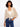 Beige crochet shrug with elbow dolman sleeves and adjustable tie-front design, perfect for layering by Charlie B.