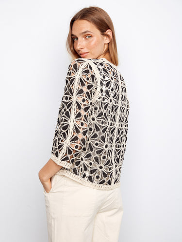 Exquisite craftsmanship is showcased in the floral crochet pattern of this versatile V-neck top for timeless appeal by Charlie B.