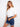 Chic white jacket featuring short length, styled effortlessly with rolled sleeve details for a trendy ensemble by Charlie B.
