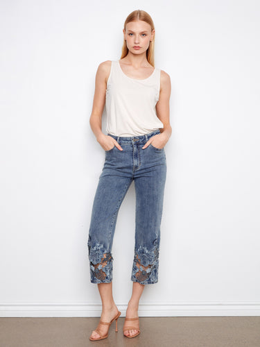 Denim jeans featuring a stylish flare fit and intricate lace hem detail, perfect for adding flair to any outfit. By Charlie B.