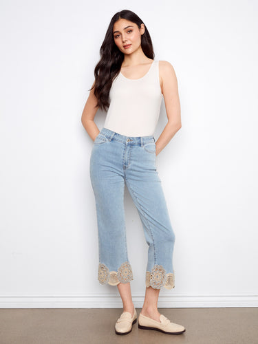 Light blue cropped flare jeans with five pockets, offering a chic and practical style by Charlie B.