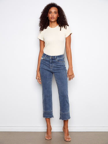 These jeans feature a cropped length with stretch denim for comfort, complete with a scallop cuff detail by Charlie B.