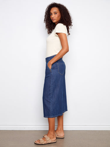 Featuring convenient slash pockets, these denim pants combine practicality with style effortlessly. By Charlie B.