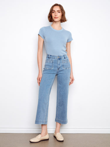 These jeans feature a stylish flare fit, adding a touch of modern elegance to any outfit. Crafted with care by Charlie B.
