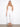 White cropped flare twill pants with regular rise and back pockets, modeled stylishly by Charlie B.